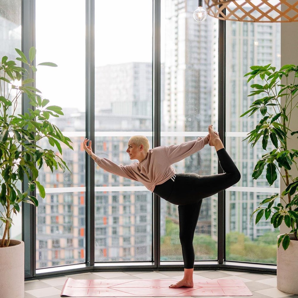 Yoga pose at The Collective Canary Wharf